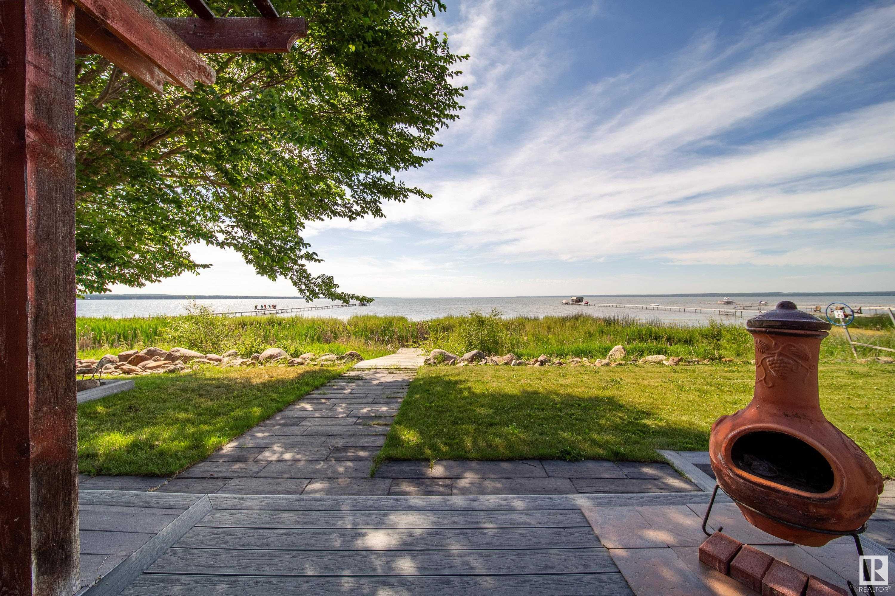 Property Photo: 103 Argentia Beach SE AB T0C 2C0