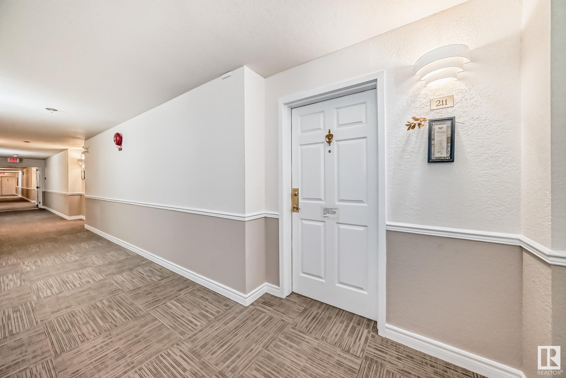 Property Photo:  10915 21 Avenue NW 211  AB T6J 6X2 
