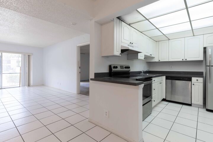 Property Photo:  490 NW 20th Street 1050  FL 33431 