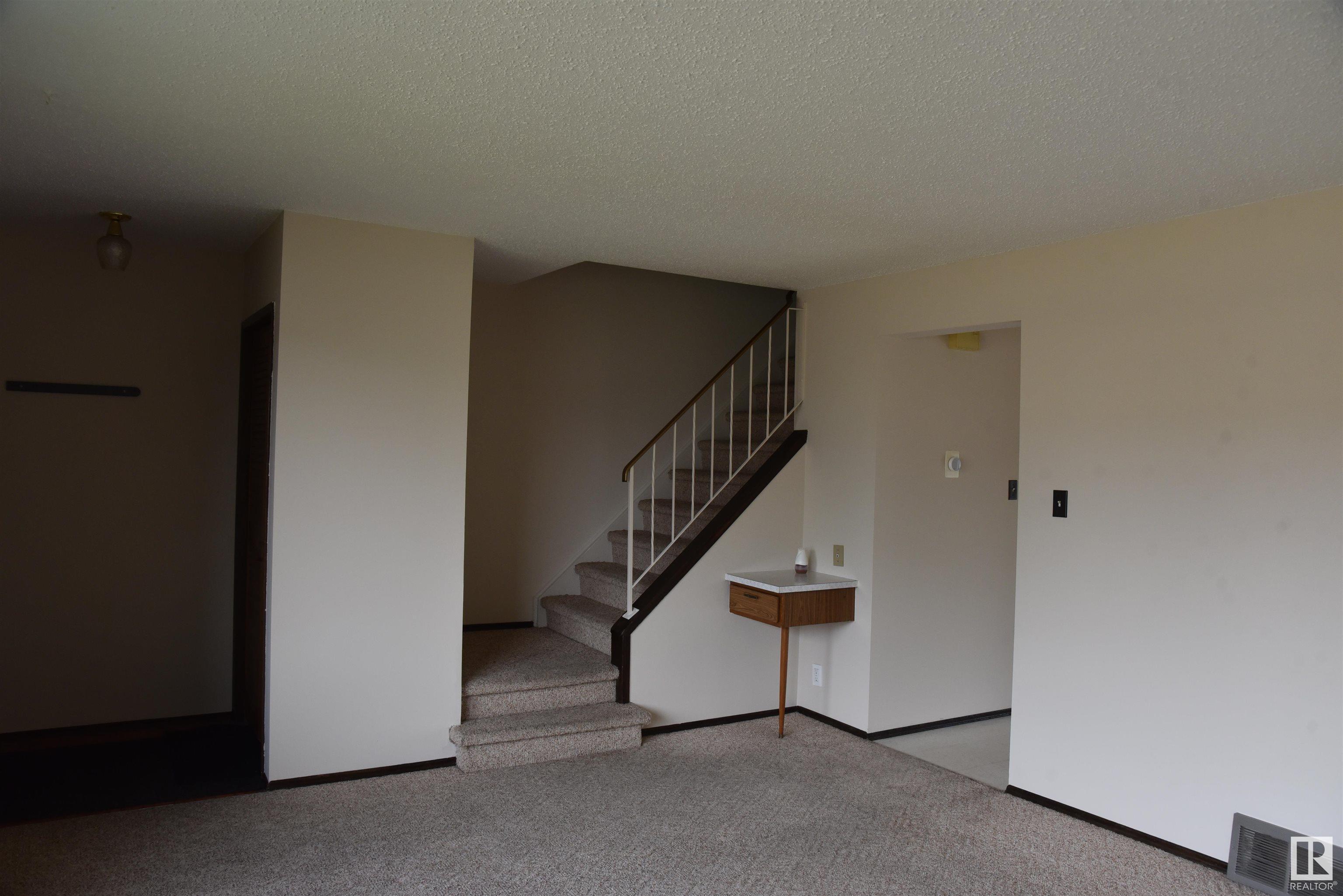 Property Photo:  7015 101 Avenue NW  AB T6A 0H6 