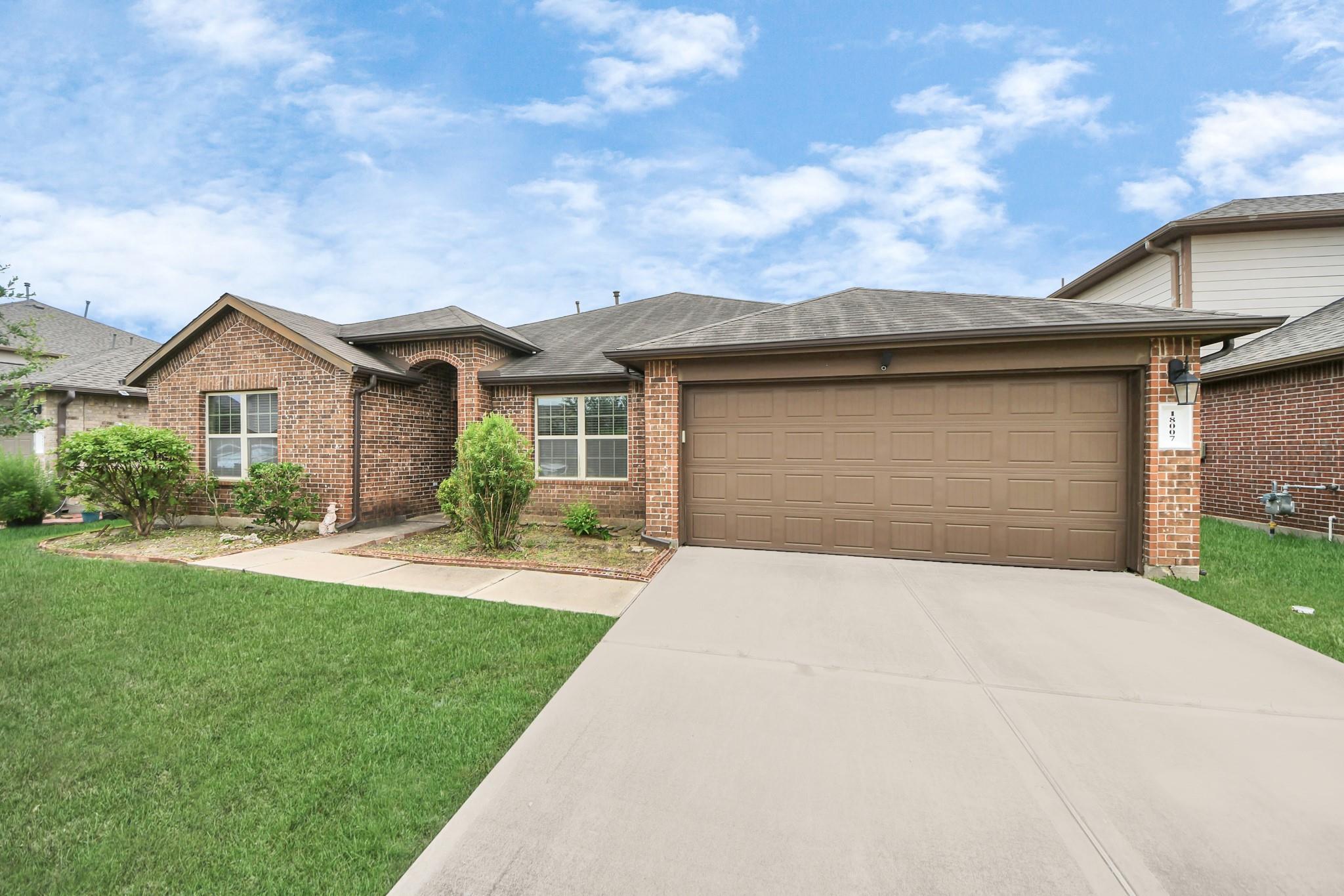 Property Photo: 18007 Tenasserim Pine Trace TX 77407