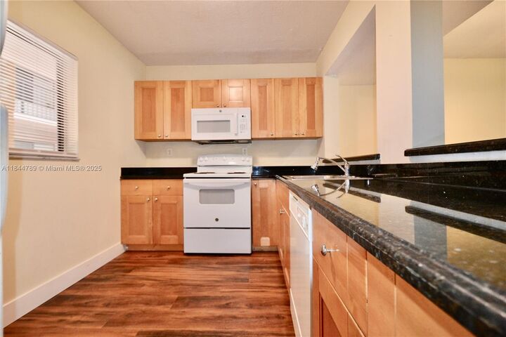 Property Photo:  8520 SW 133rd Ave Rd 203  FL 33183 
