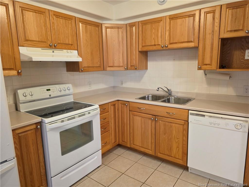 Property Photo: 1 Golf Greens Lane 304 NB E3B 9T9