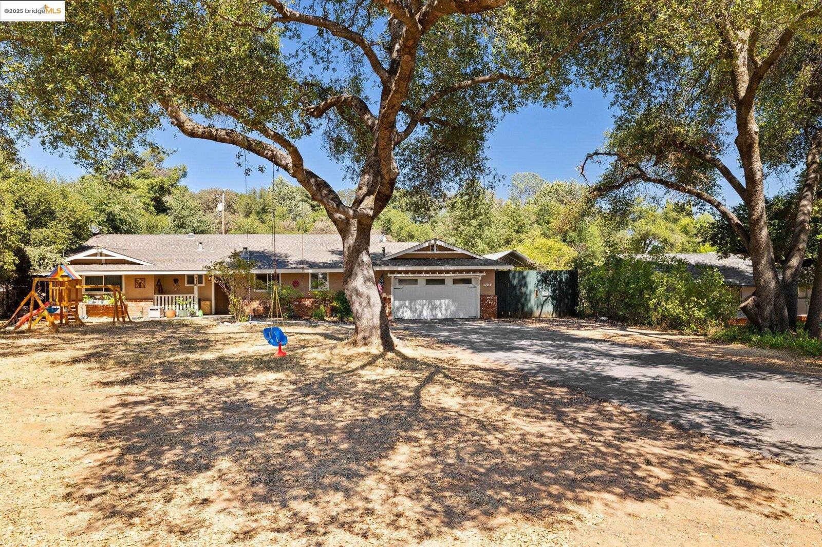 Property Photo: 20369 E Walnut Dr CA 95370