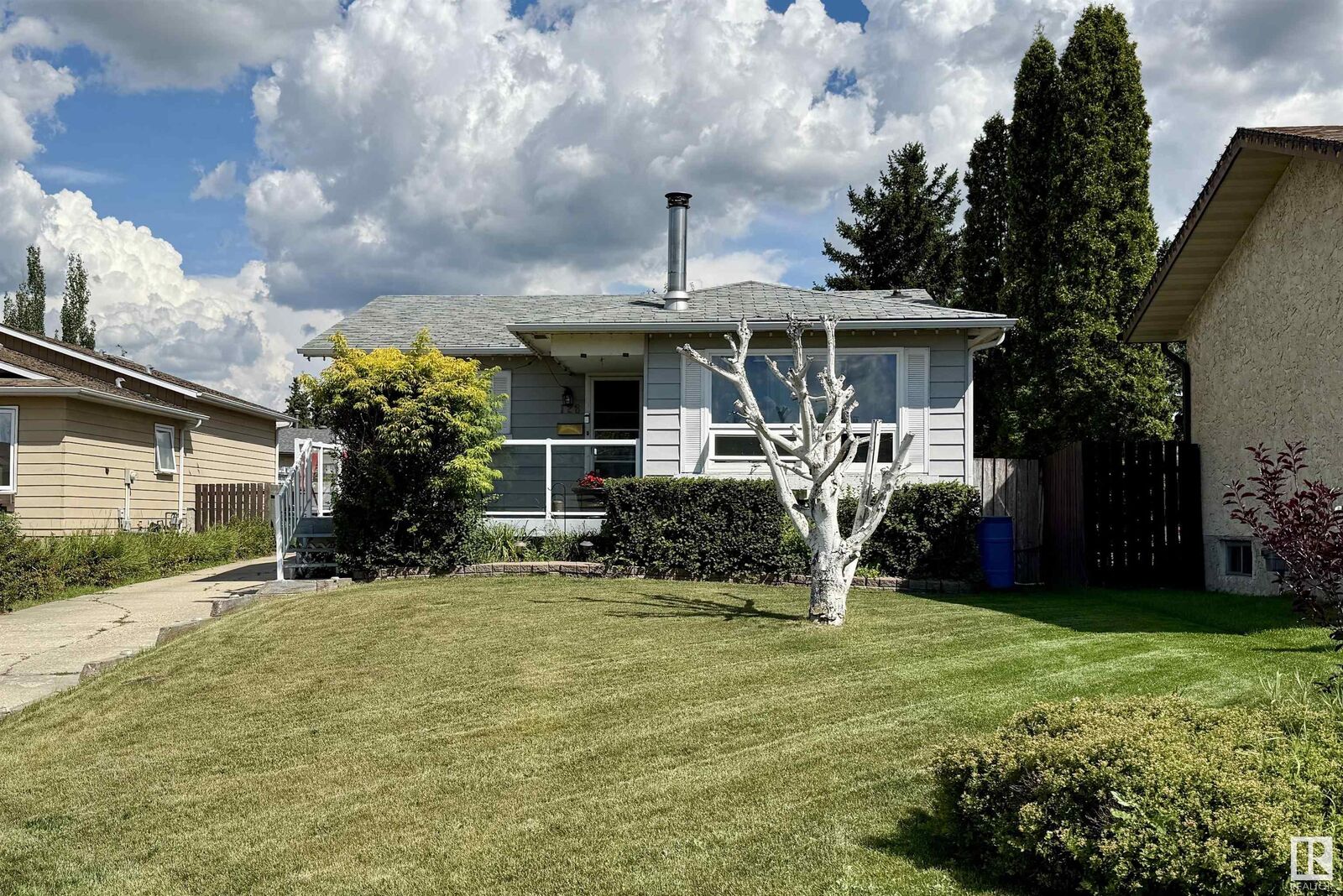 Property Photo: 128 Warwick Road NW AB T5Y 4P8
