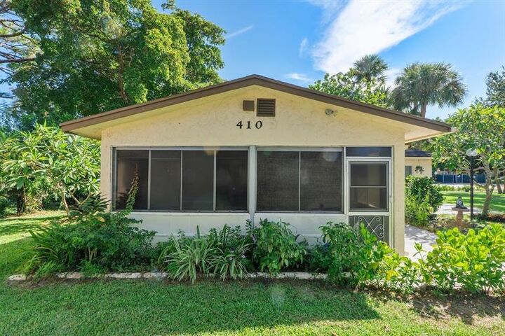 Property Photo:  410 SW Natura Ave  FL 33441 
