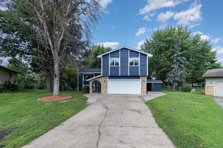 Property Photo:  2912 80th Circle N  MN 55444 