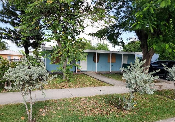 Property Photo: 1461 NW 2nd Ct FL 33034