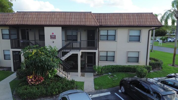 Property Photo:  7091 Golf Colony 203 Court 203  FL 33467 