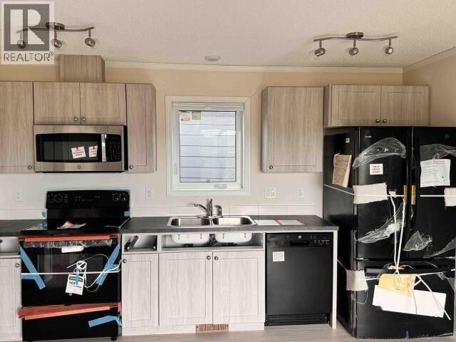 Property Photo:  3 Duplexes Req Relocation  NT  