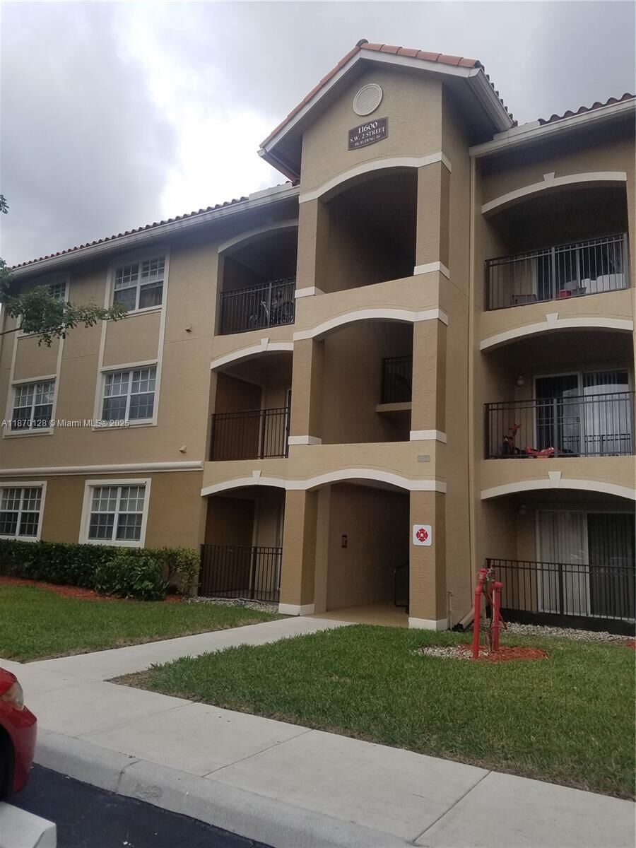 Property Photo:  11600 SW 2nd St 18101  FL 33025 