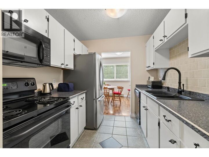 Property Photo:  1860 Richter Street 205  BC V1Y 2M9 