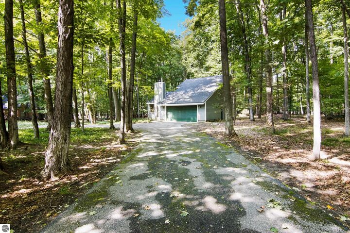 Property Photo:  2345 Kenona Woods Drive  MI 49696 