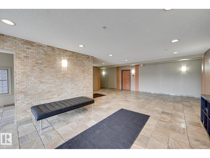 Property Photo:  #215 13830 150 Av NW  AB T6V 1X2 