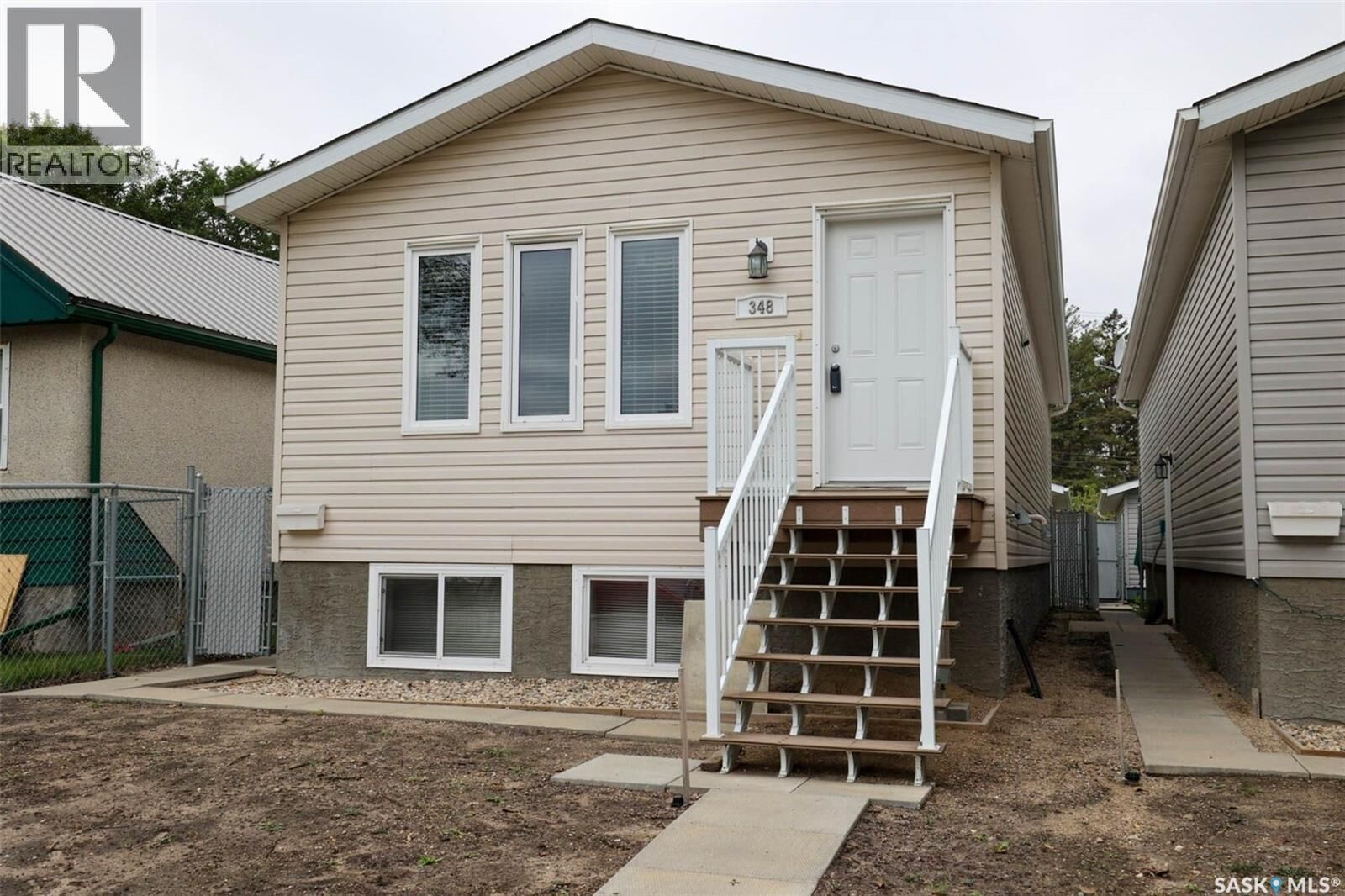 Property Photo:  348 Robinson Street  SK S4R 3R2 