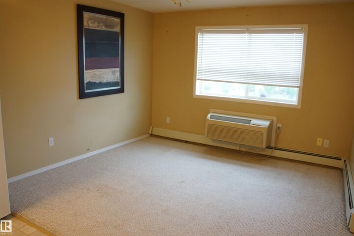 Property Photo: 8802 Southfort Drive 403 AB T8L 4R6