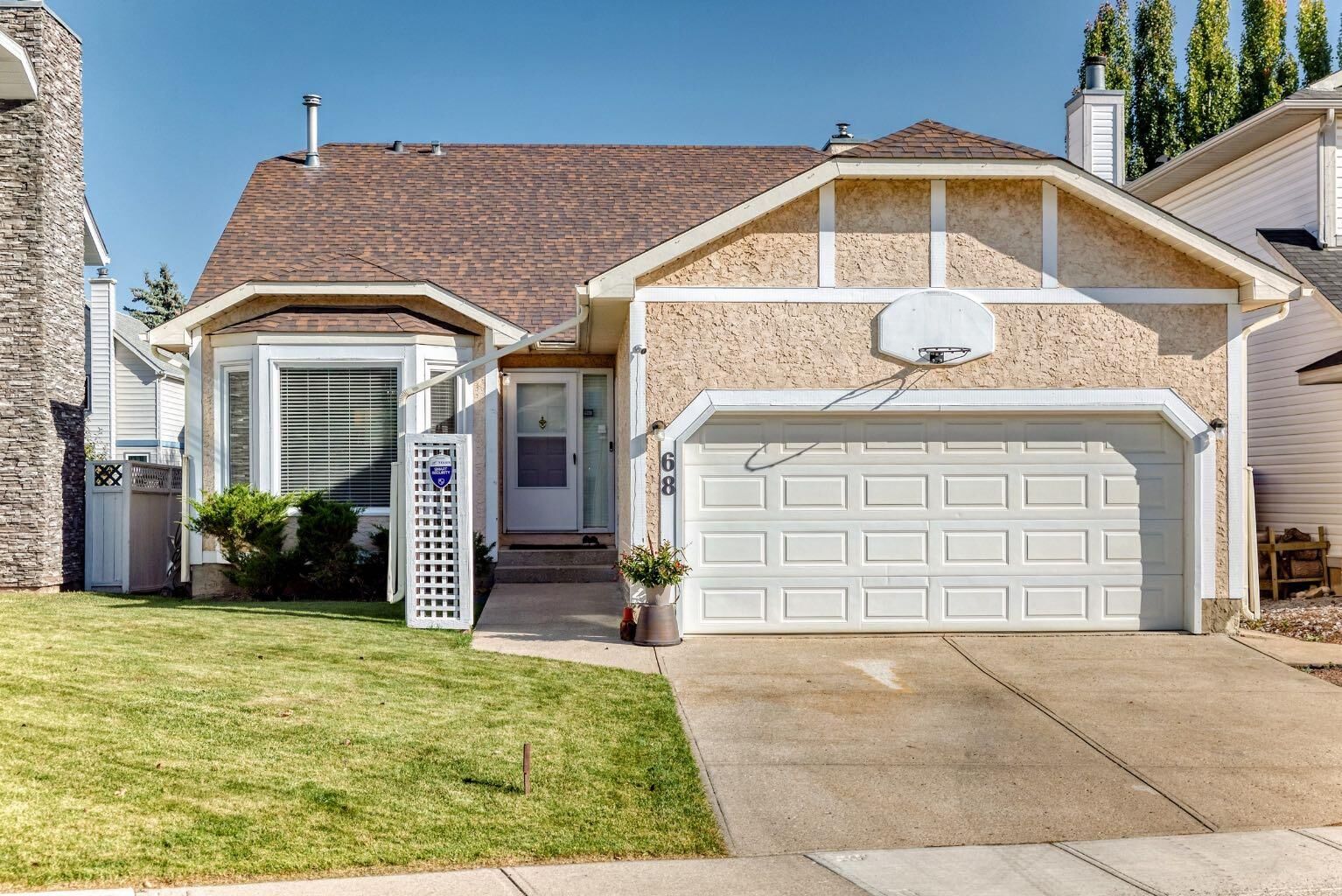 Property Photo: 68 Woodmark Crescent SW AB T2W 4Z2