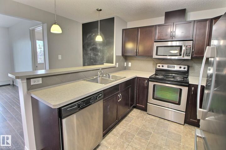 Property Photo: 5951 165 Avenue NW 205 AB T5Y 0J6