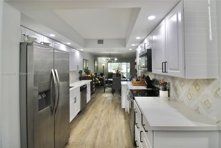 Property Photo:  1200 SW 125th Ave 105L  FL 33027 