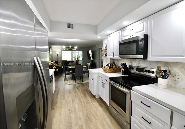 Property Photo:  1200 SW 125th Ave 105L  FL 33027 