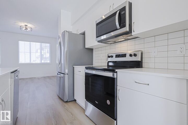 Property Photo:  6347 King Wynd SW  AB T6W 5P1