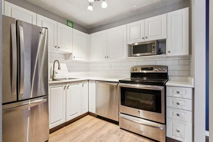 Property Photo:  231 Heritage Drive SE 47C  AB T2H 1N1 