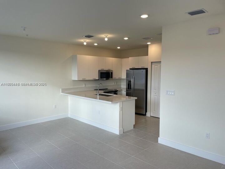 Property Photo: 6453 NW 102nd Path 305 FL 33178