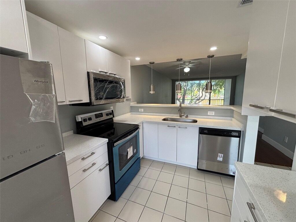 Property Photo:  6000 NW 64th Avenue 211  FL 33319 