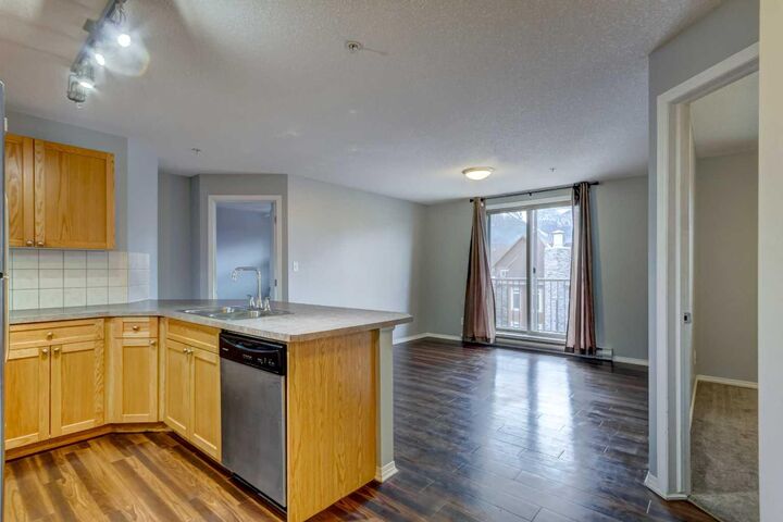 Property Photo:  186 Kananaskis Way 213  AB T1W 0A2 