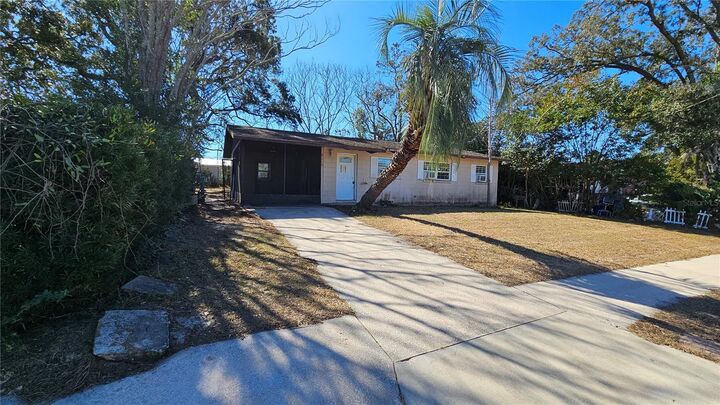 Property Photo:  2115 Woodland Boulevard  FL 34748 