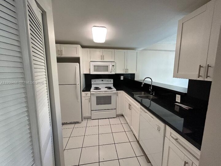 Property Photo:  11780 SW 18th St 202-2  FL 33175 
