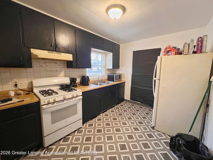 Property Photo:  1022 Persons Court  MI 48906 