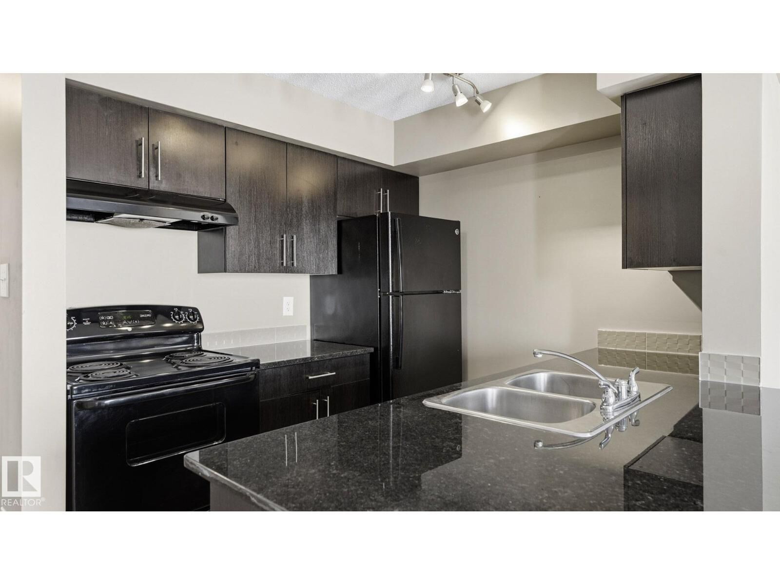 Property Photo:  #319 274 McConachie Dr NW  AB T5Y 3N4 