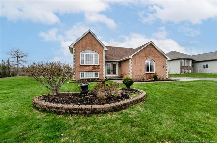 Property Photo: 717 Royal Oaks Boulevard NB E1H 3N8