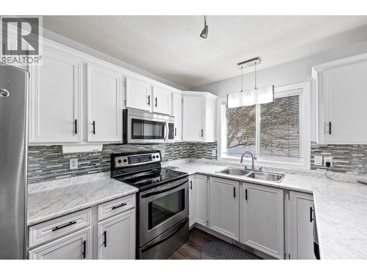 Property Photo:  1255 Raymer Avenue 493  BC V1W 3S3 