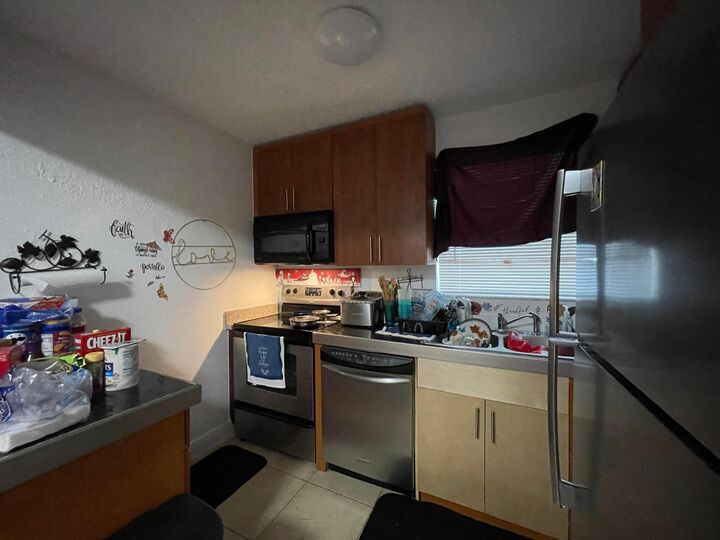 Property Photo:  400 NW 65th Avenue 114  FL 33063 