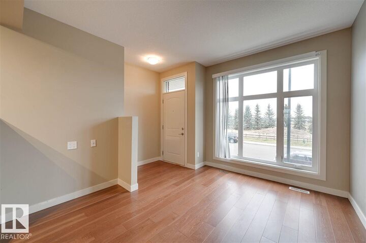 Property Photo: 1647 Cunningham Way SW AB T6W 0V8