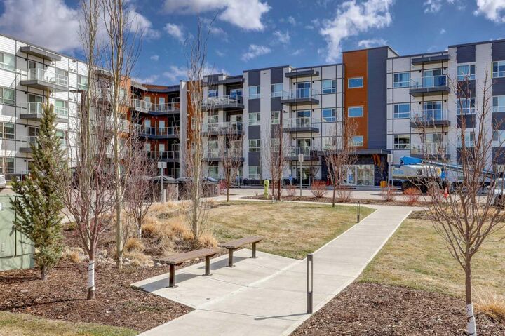 Property Photo: 360 Harvest Hills Way 106 AB T3K 2S1