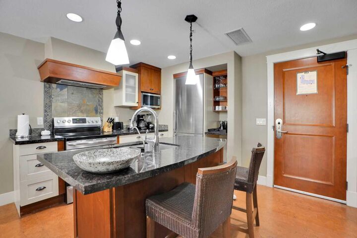 Property Photo:  187 Kananaskis Way 210  AB T1W 0A3 