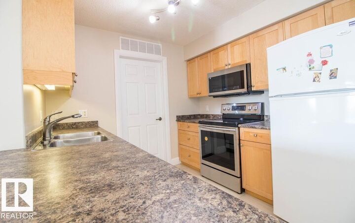 Property Photo:  13111 140 Avenue NW 418  AB T6V 0B1 