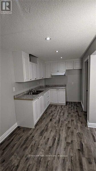 Property Photo:  697 Ferguson Drive Bsmt  ON L9T 7C7 