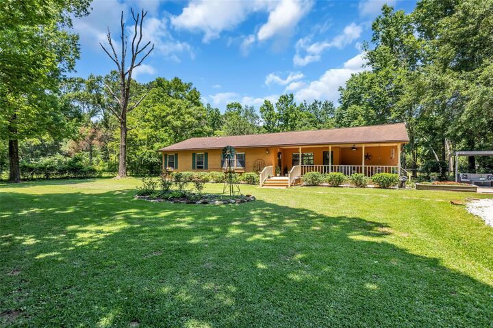 Property Photo: 1439 County Road 318 TX 77327