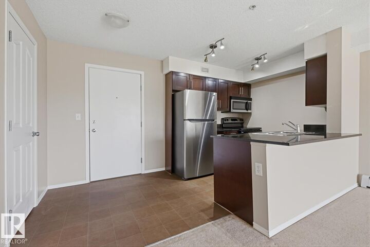 Property Photo:  11804 22 Avenue SW 303  AB T6W 2A2 