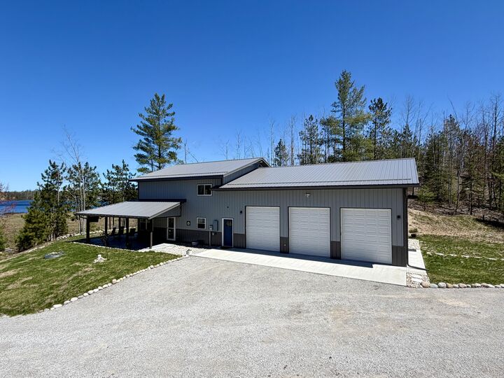 Property Photo:  8690 Winding Rdg Drive  MI 49759 