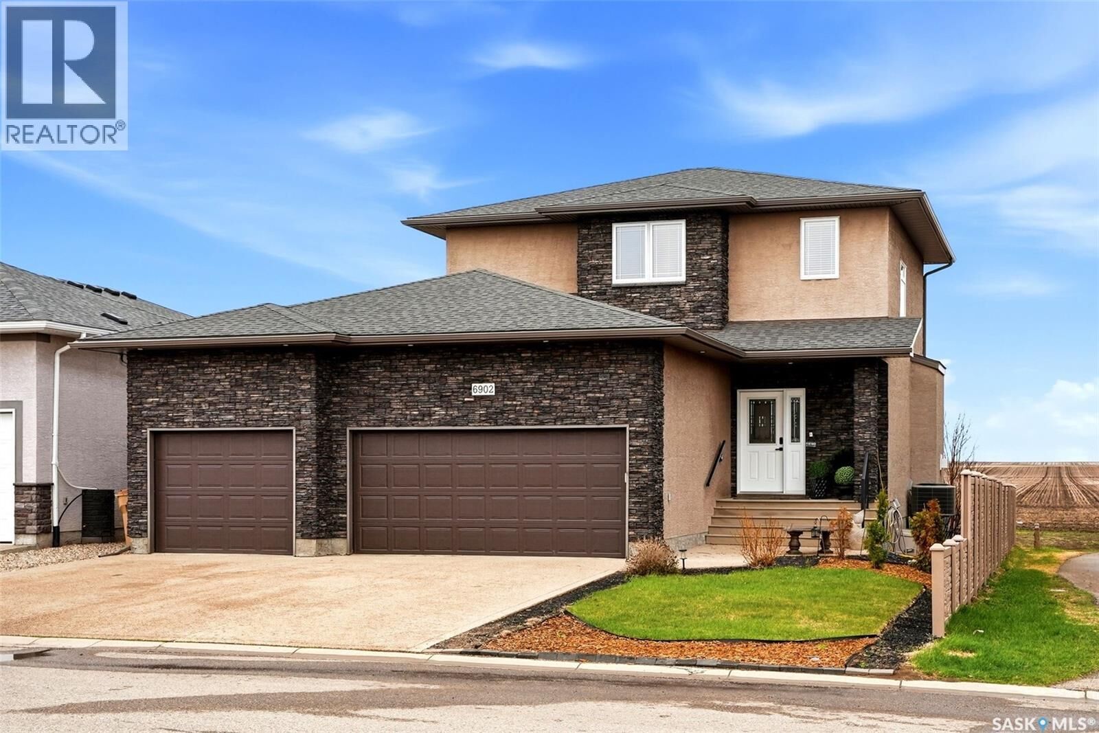 Property Photo: 6902 Maple Vista Drive SK S4X 0J8