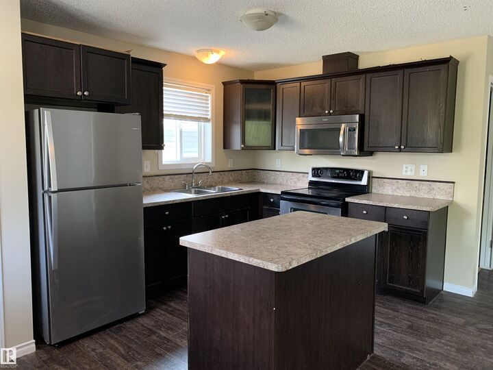 Property Photo: 11824 93 Street NW AB T5G 1E3