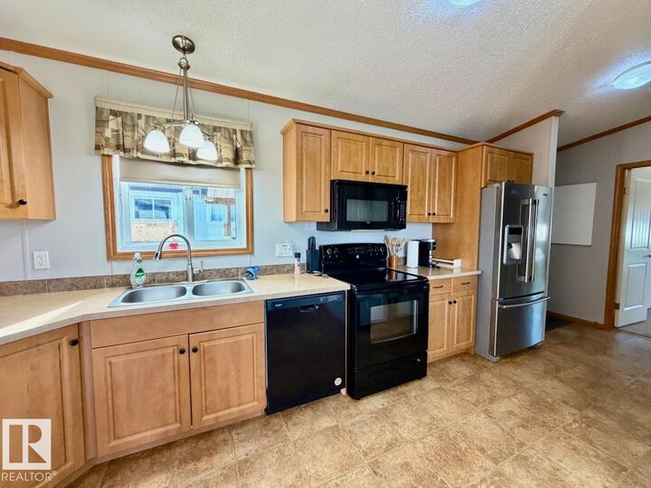 Property Photo:  110 2251 50 Street  AB T7A 1W1 