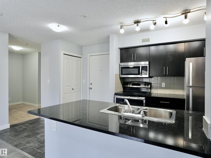 Property Photo: 5816 Mullen Place NW 320 AB T6R 0W3