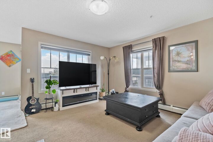 Property Photo: 103 Ambleside Drive SW 206 AB T6W 0J4