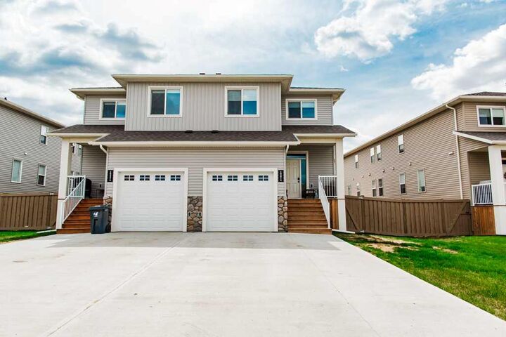 Property Photo:  10301A 149 Avenue  AB T8X 0R8 